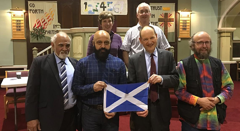 Interfaith Scotland group photo with Scottish flag