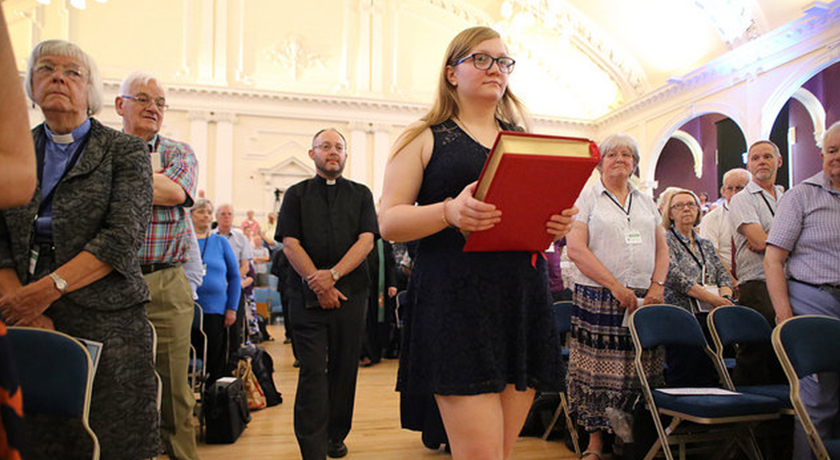 Hannah carrying bible