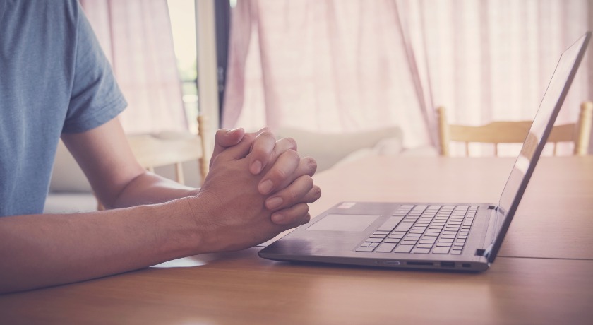 Man at laptop credit Sewcream AdobeStock 344070717