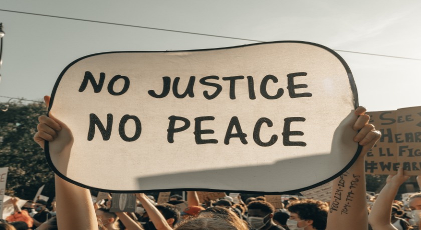 No justice no peace credit clay banks Unsplash