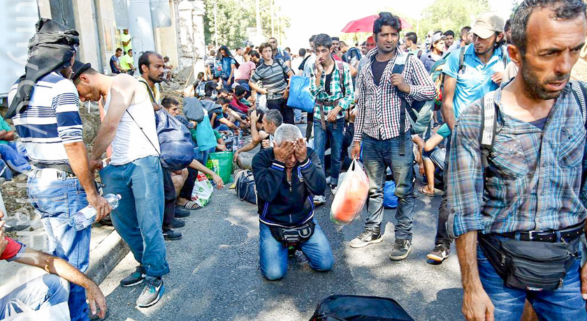 Refugees walking down street credit Freedom House