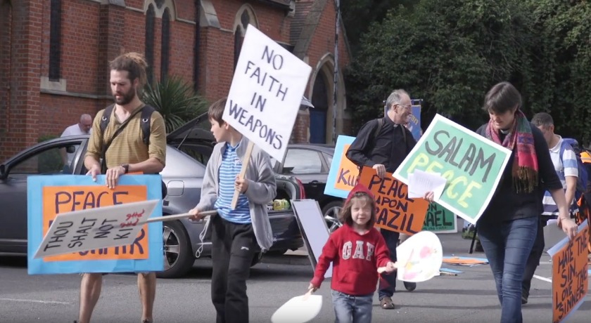 arms fair protestors news banner