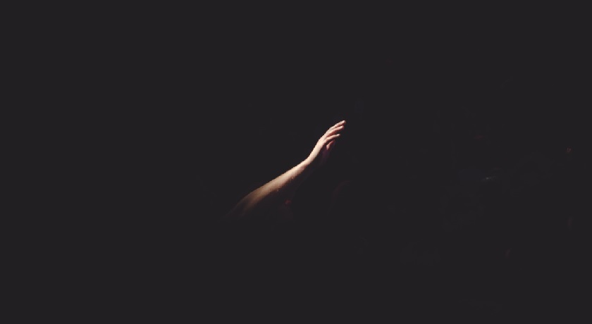 hand in the dark credit unsplash Cherry Laithang