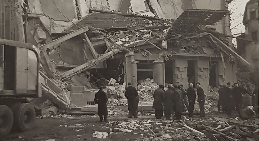 people gathered to inspect bomb damage